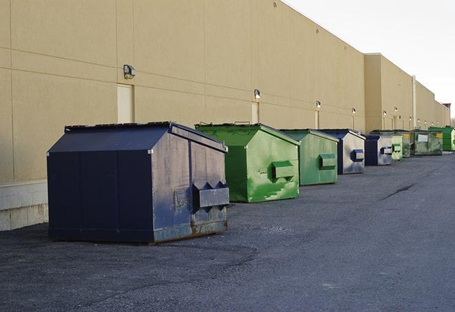 closed construction dumpster with a sign prohibiting unauthorized access in Bethalto